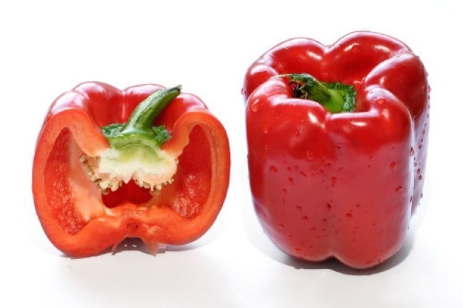 Bell pepper A whole and cross-section of a red bell pepper (pepper in the UK and capsicum elsewhere in the Commonwealth). This cultivar of Capsicum annuum has a recessive gene that eliminates the capsaicin in the fruit. The pepper scores zero on the Scoville scale, meaning it has none of the