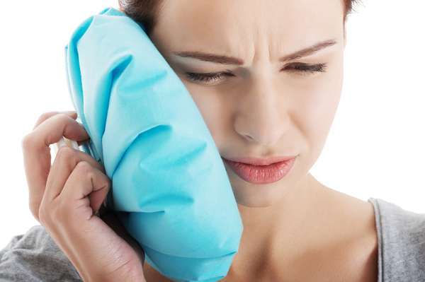 nhổ răng khôn mấy ngày hết sưng